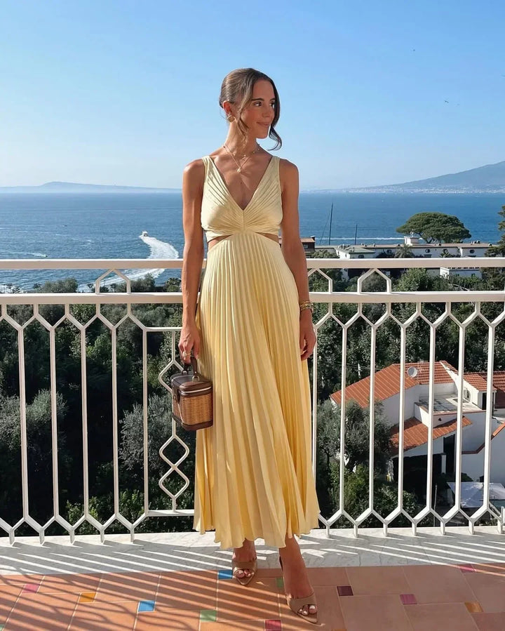 Vestido maxi amarillo con escote pronunciado y pliegues