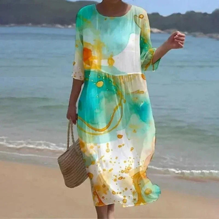 Vestido midi para mujeres con patrones variados, mangas de longitud media, estilo playero